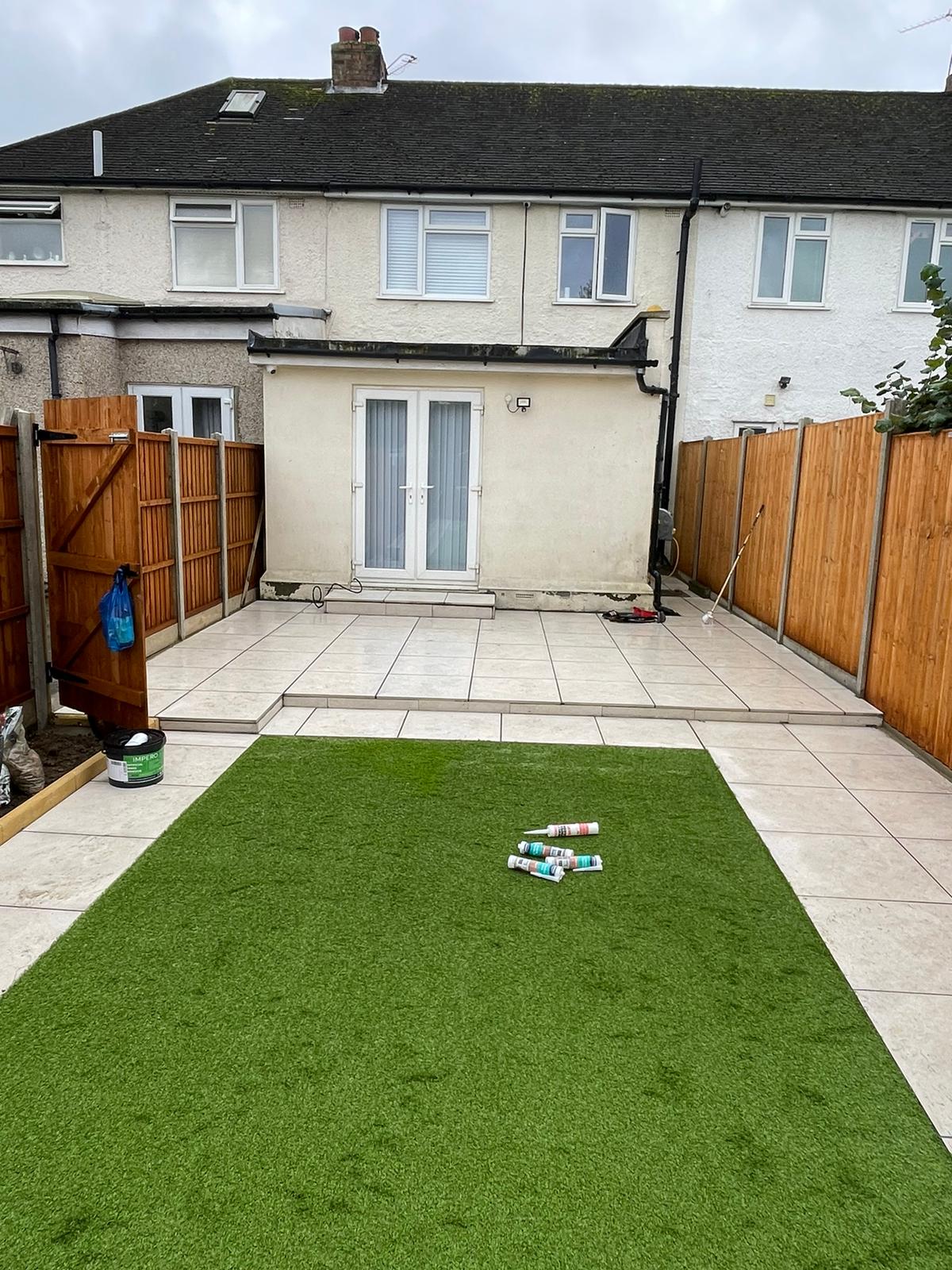 Completed garden with artificial lawn and paved borders