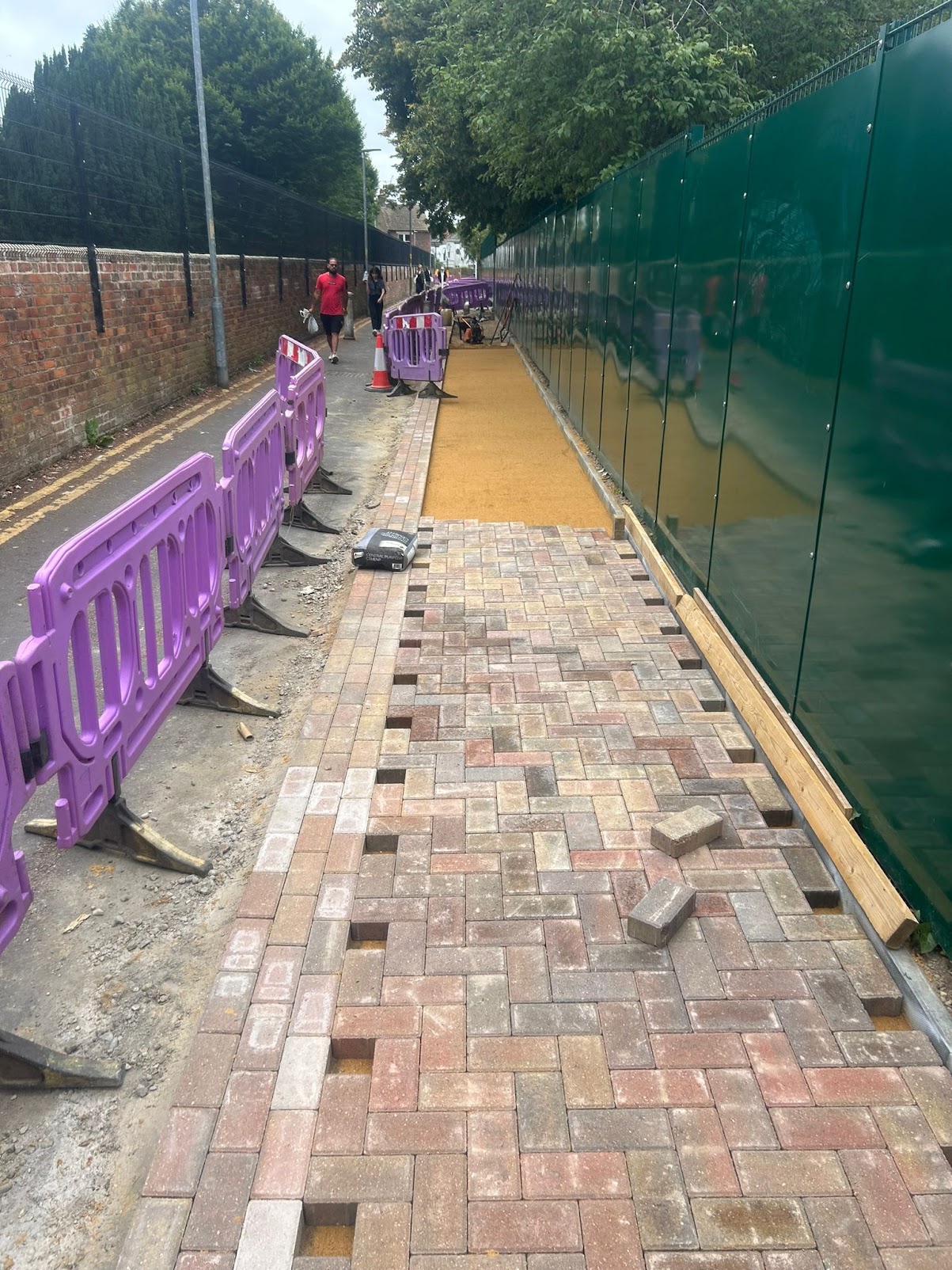 Block paving installation with bedding layer visible