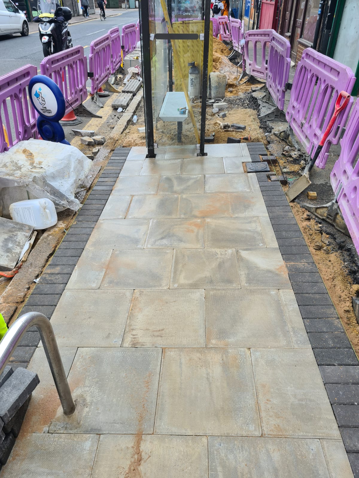 Natural stone public path with street furniture