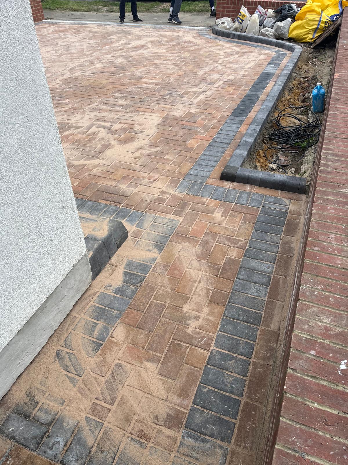 Block-paved driveway with double dark border