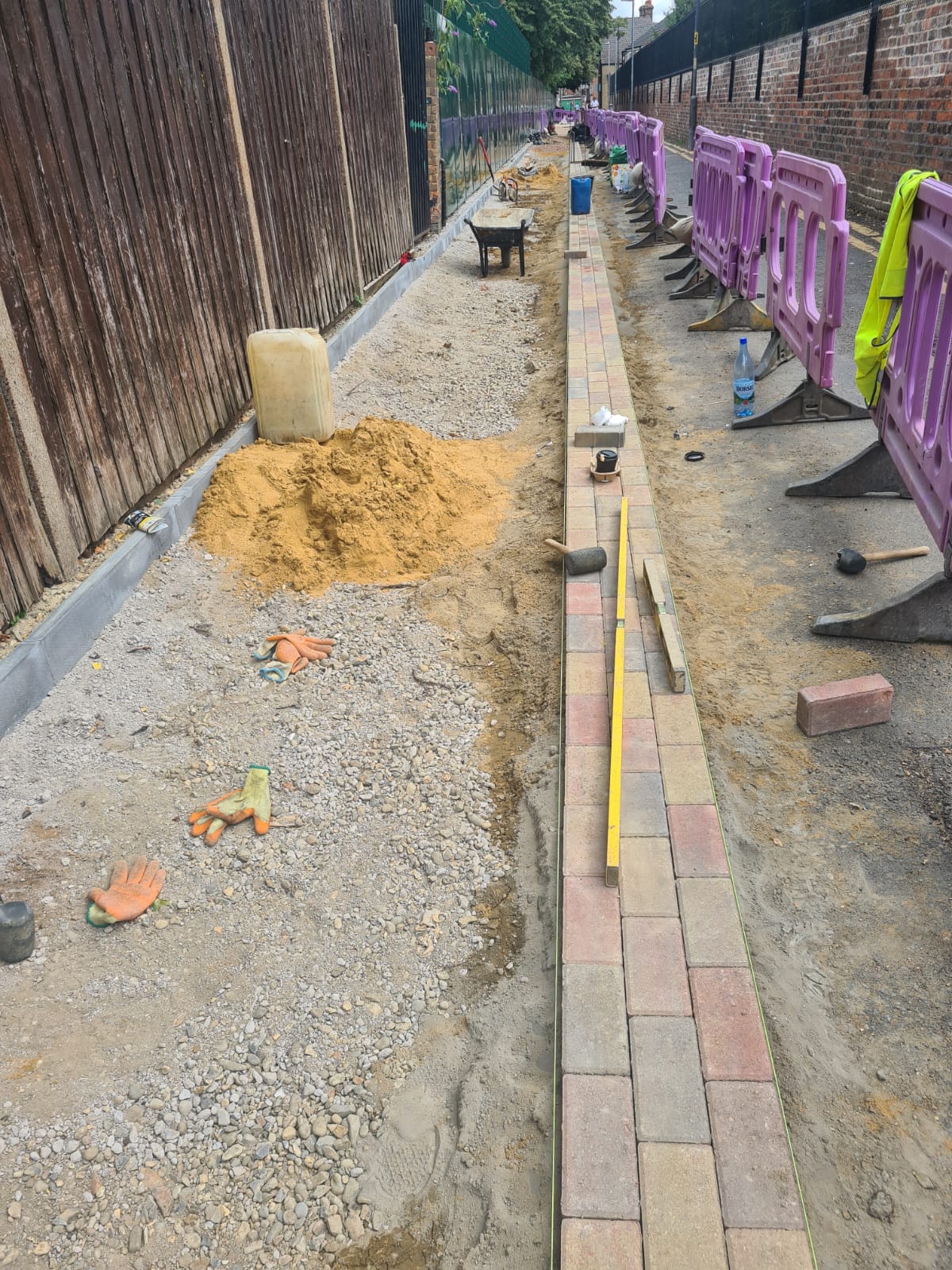 Prepared route with kerbs and bedding material