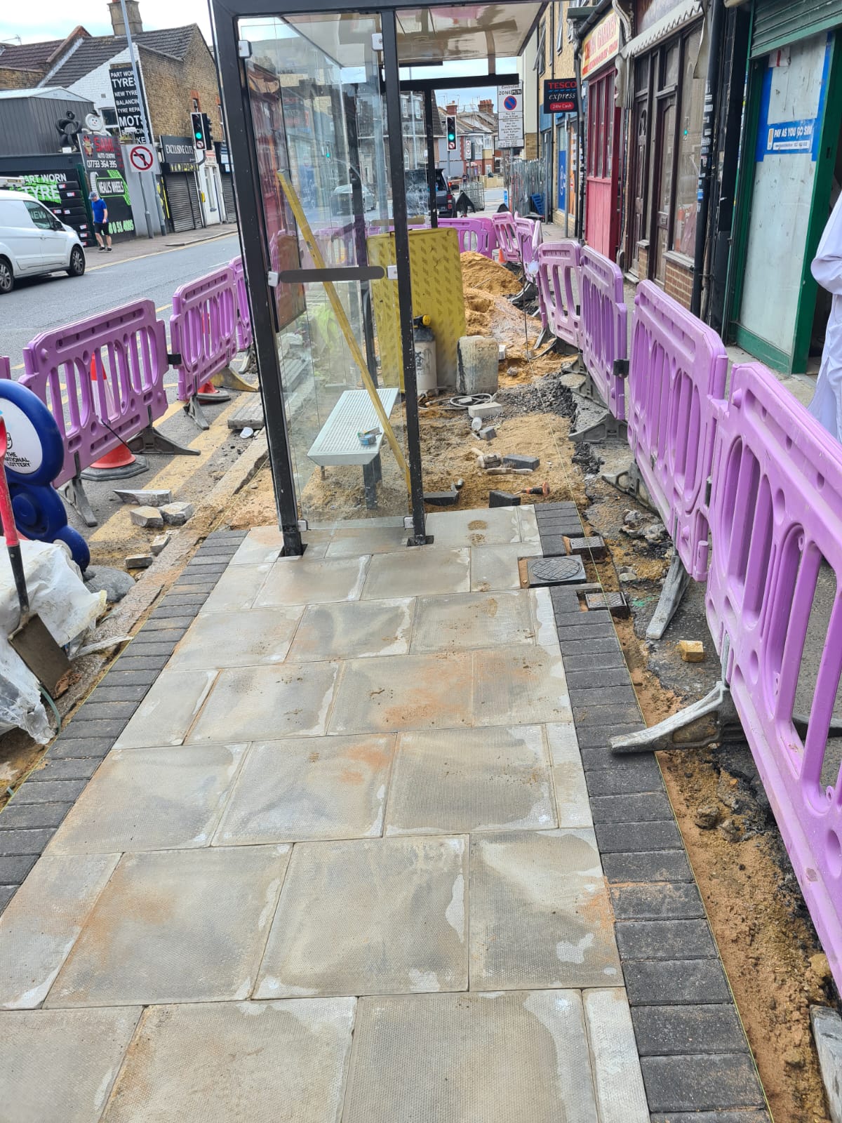 Public paving around posts and utilities