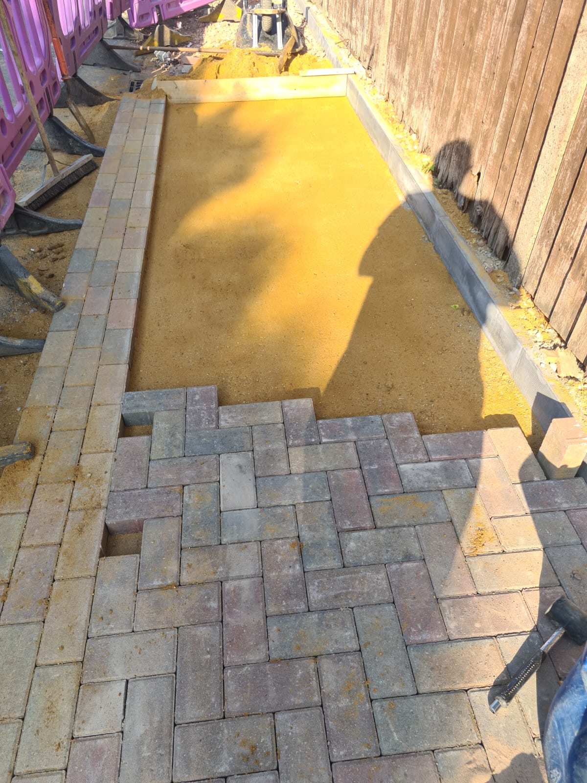 Block paving being laid over prepared bed